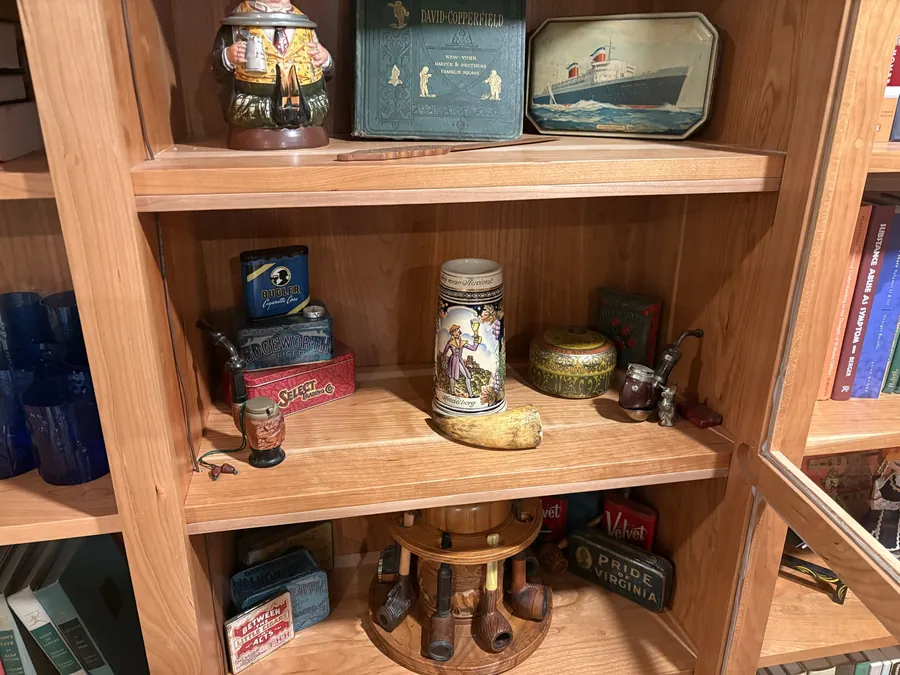 Close detail of solid cherry shelving with visible grain and a clean face frame.